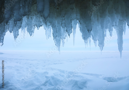 View from icy grotto to the winter Baikal lake in February day
