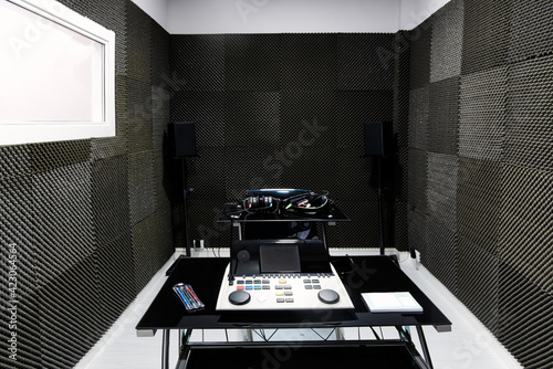 Room with soundproof foam walls and contemporary equipment for audiological examination and hearing test photo