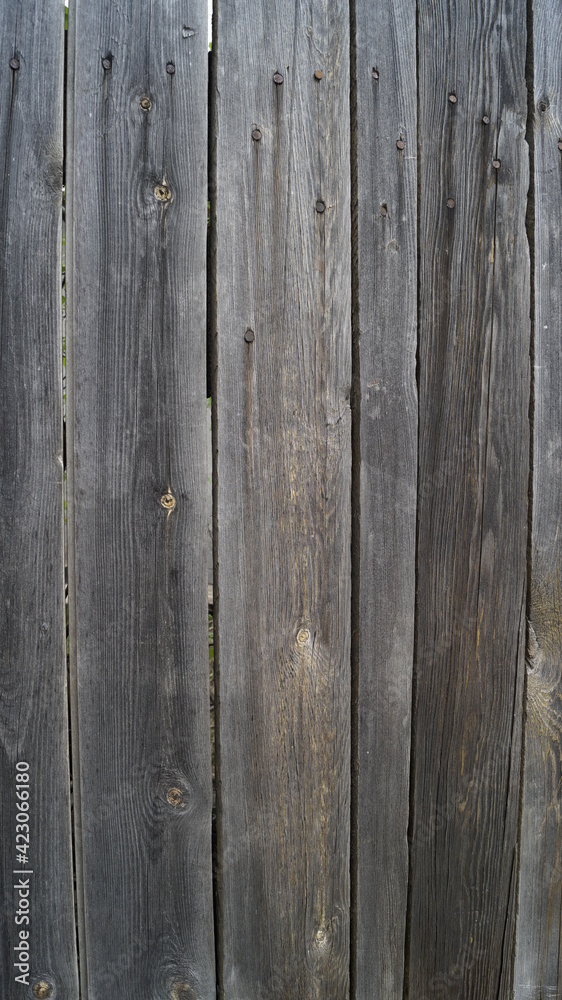 A wooden background made of grey planks A wooden background made of grey planks