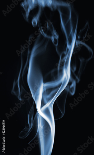 Blue smoke on a black background. Smoke texture