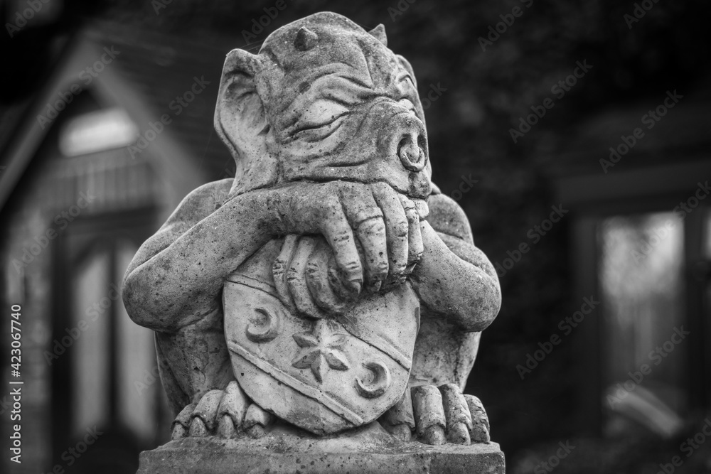 Stone gargoyle in deep sleep Stone gargoyle in deep sleep