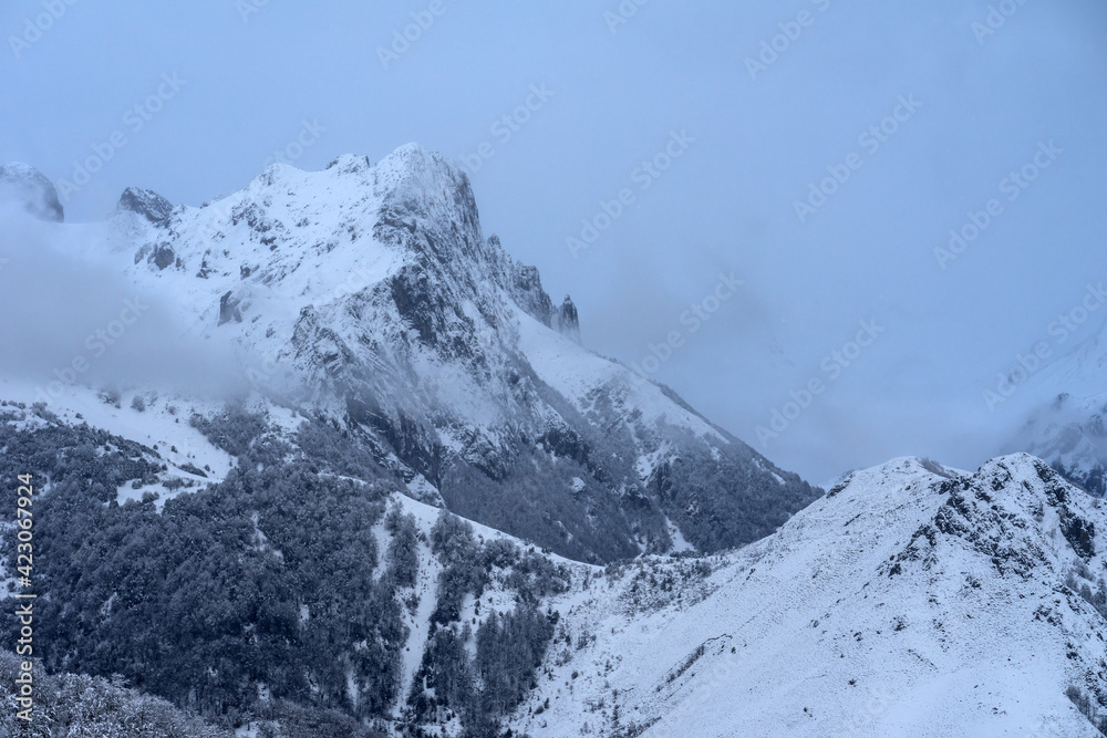 Snowing in winter landscape of the Ubiñas la Mesa Natural Park mountains Snowing in winter landscape of the Ubiñas la Mesa Natural Park mountains