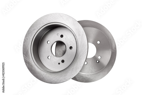 2 brake discs lies one on top of the other, car spare parts top view isolated on white background.