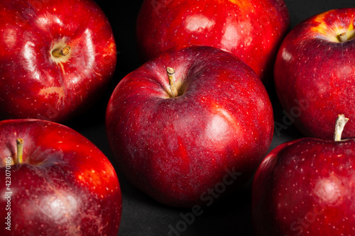 red apple on black background