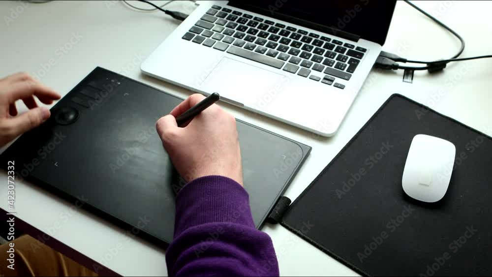 man graphic designer working on laptop