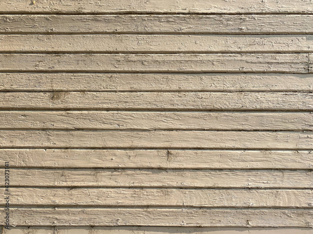 close up view of white painted wooded wall of barn or farm shed or house siding and weathered retro vintage style