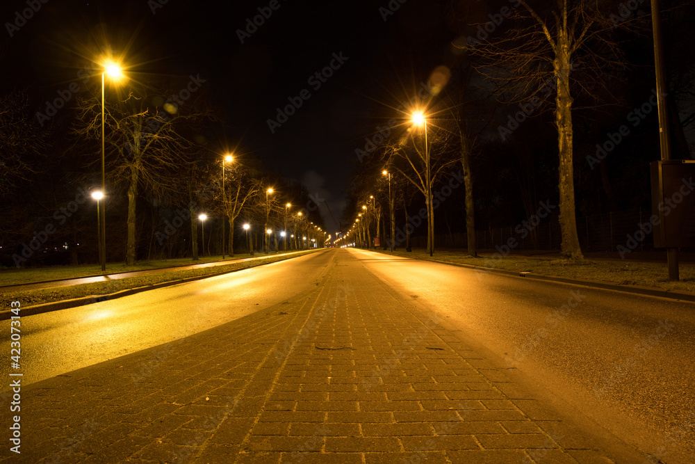 An empty street at night in the city Schiedam, The Netherlands during lockdown COVID-19 corona.