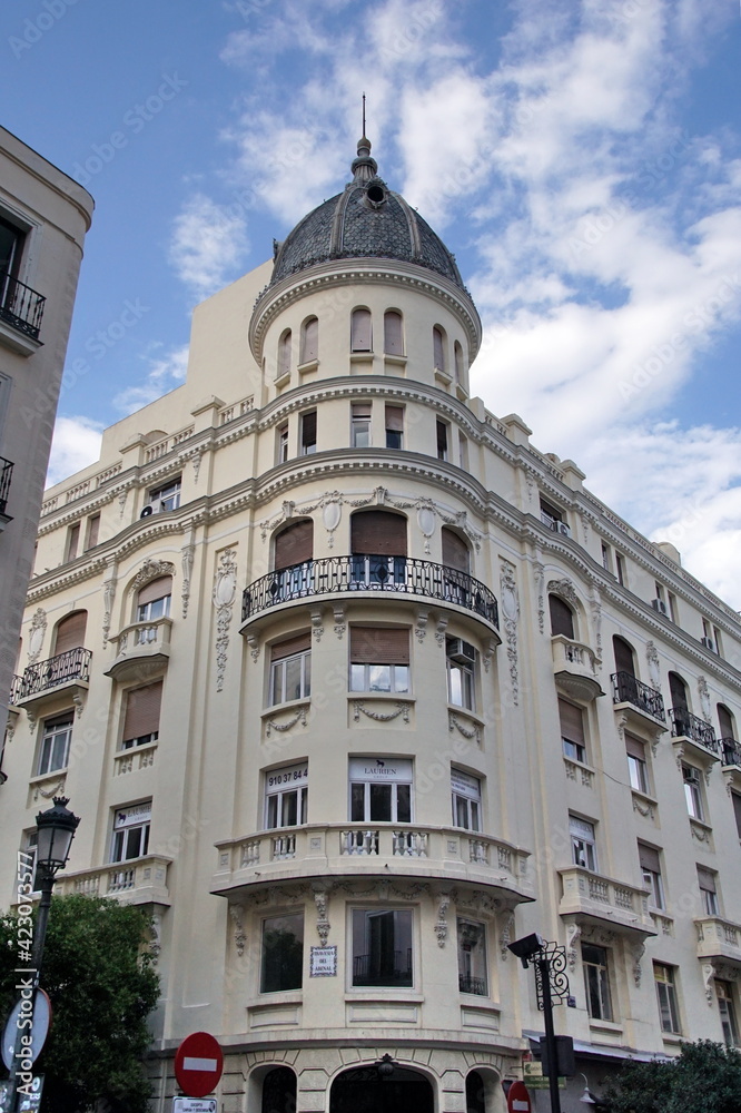 Mediterranean architecture in Spain. Old apartment buildings in Madrid - Calle Mayor.