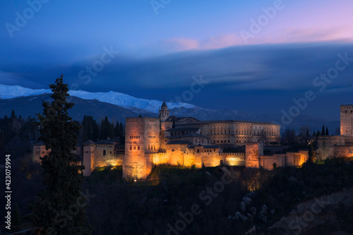 Classic view of the Alhambra from Mirador de San Nicolás, El Albaicín, Granada, Spain, at late evening