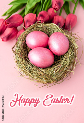 easter background with delicate color pink paint eggs on beige background