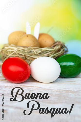 Happy Easter holiday text in italian card, Easter eggs as the color of the Italian flag - green, white, red