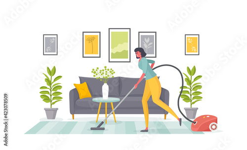 Cleaning of apartment. Wife or maid vacuums carpet in living room. Home chores, housekeeping