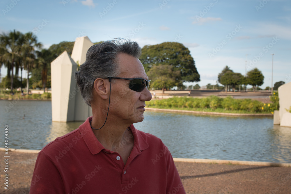 Senior Man enjoying himself at the Crystal Park (Praça dos Cristais) in Brasilia, Brazil