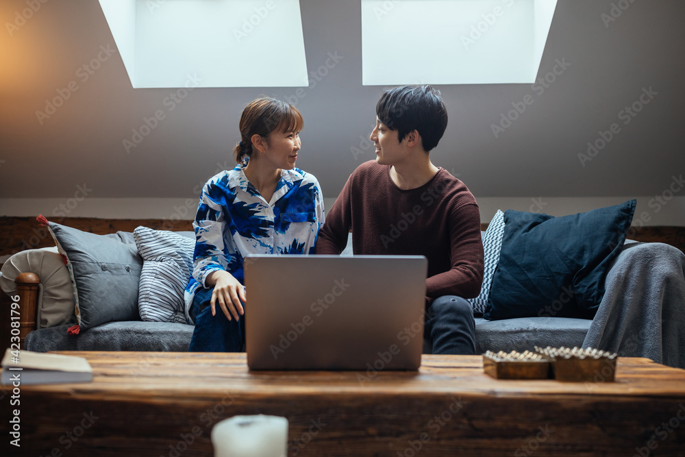 Japanese couple having video call in the living room Japanese couple having video call in the living room