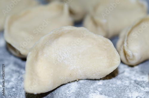 On the table are dumplings in flour.