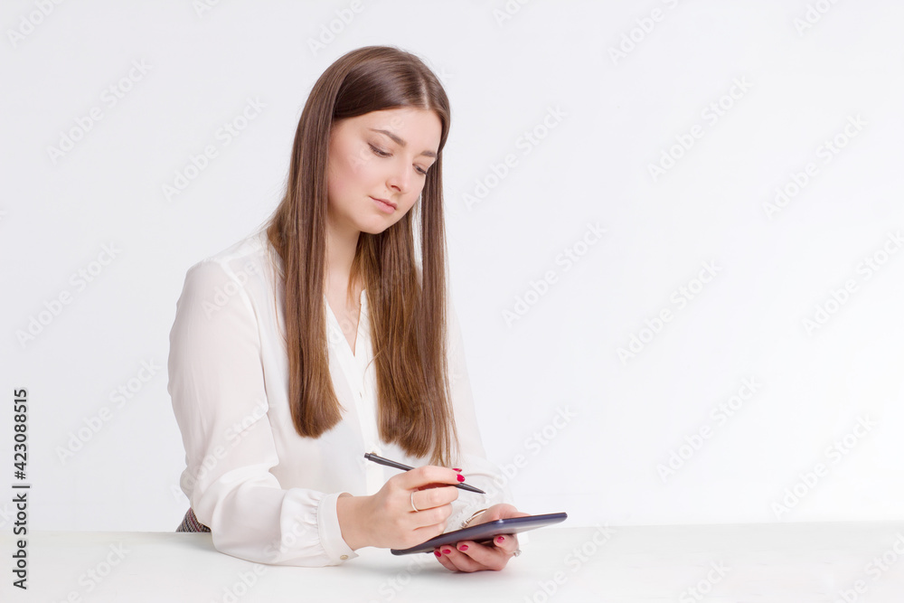 portrait of a young businesswoman in a white shirt portrait of a young businesswoman in a white shirt