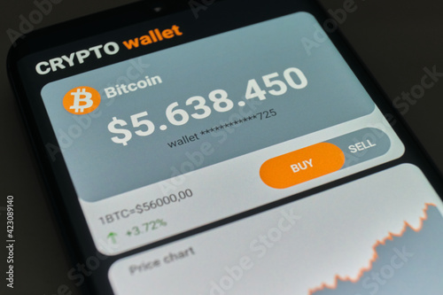 Balance of bitcoin wallet in mobile application close up. Smartphone with mobile application cryptocurrency wallet. The concept of cryptocurrency trading