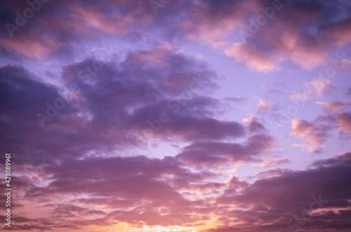 Lilac pink sunset with clouds.