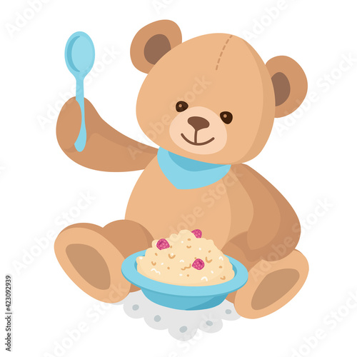 Teddy Bear eating Porridge with berries on breakfast. Kid learns to eat himself. Cute stuffed Toy with his First spoon. 
