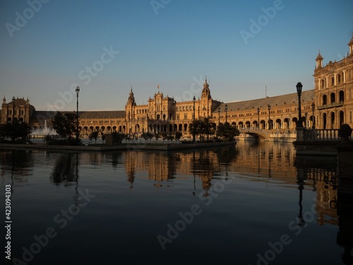 Plaza de Espana spain square lake water pond mirror reflection of pavillon building in Sevilla Andalusia Spain Europe photo