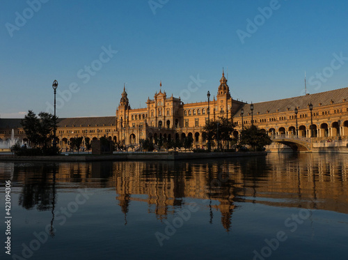 Plaza de Espana spain square lake water pond mirror reflection of pavillon building in Sevilla Andalusia Spain Europe photo