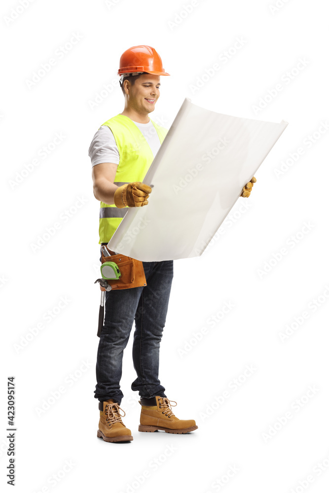 Full length shot of a construction worker holding a blueprint Full length shot of a construction worker holding a blueprint