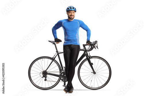 Male cyclist sitting on a road bicycle and posing
