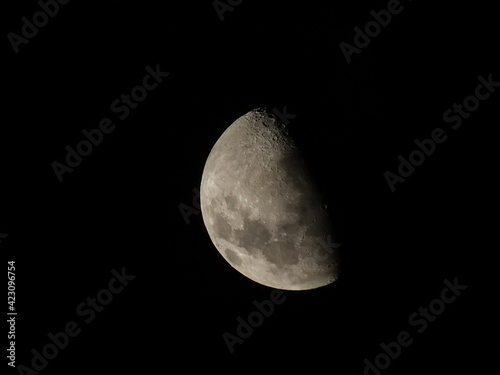 half moon shining on the sky