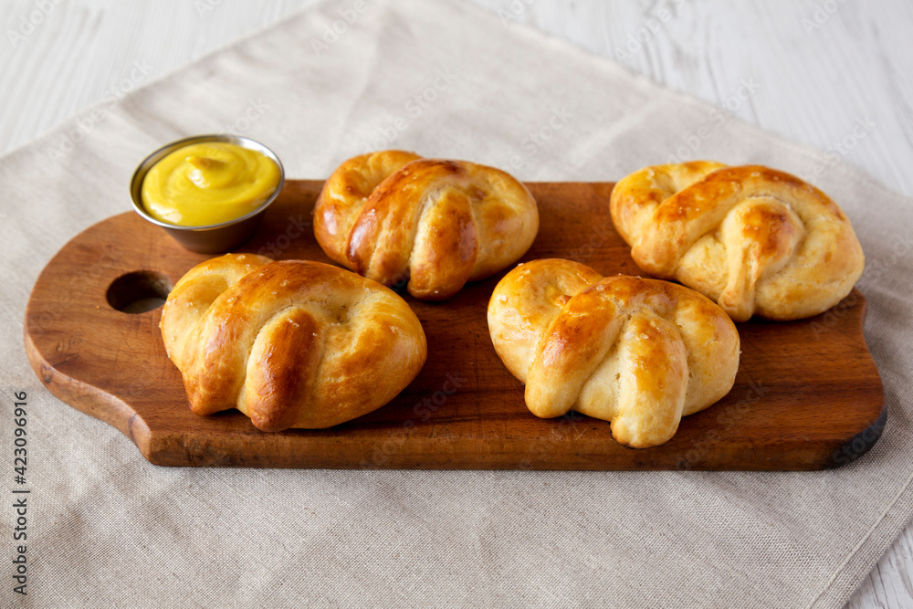 Homemade Basic Soft Pretzels with Mustard, side view.