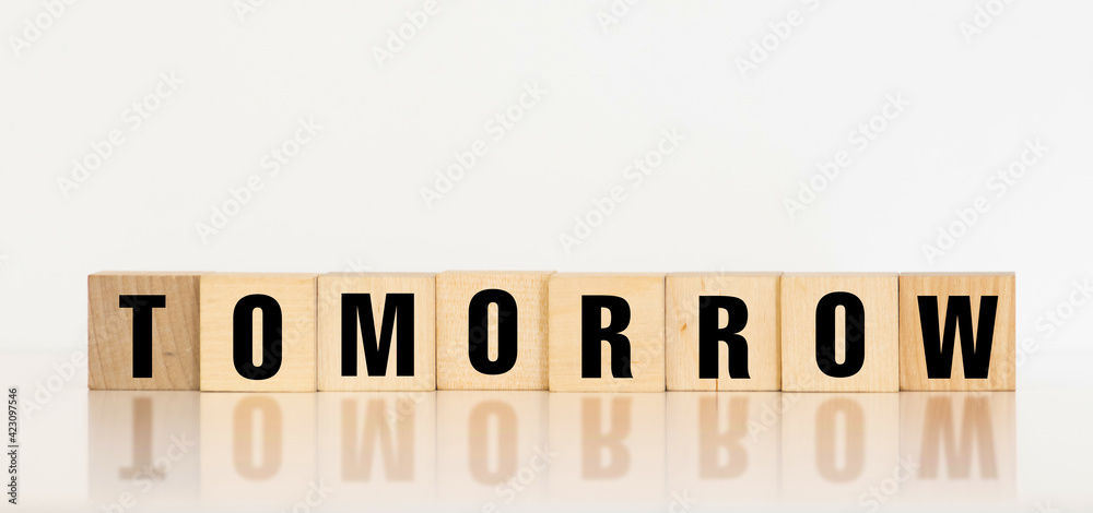 TOMORROW word made with building blocks, concept TOMORROW word made with building blocks, concept