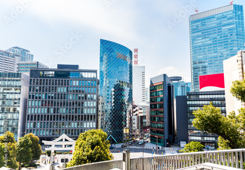 Photography Modern glass office buildings in downtown Tokyo, Japan, on a partly cloudy sprin