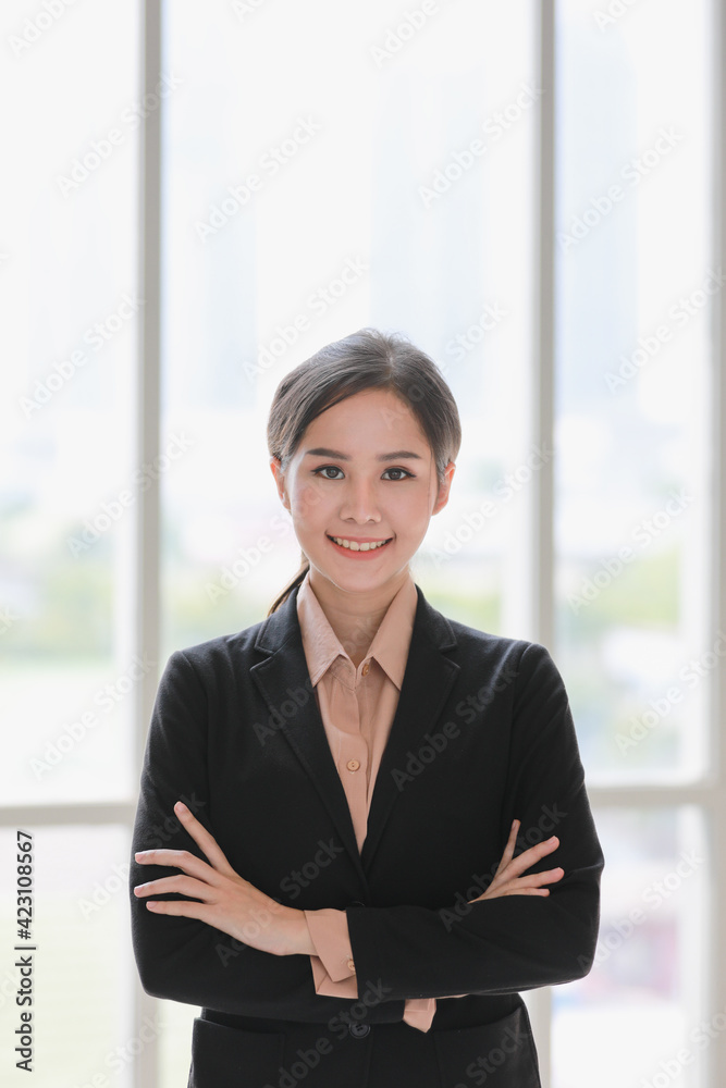 Beautiful Asian businesswoman standing and smile.. Beautiful Asian businesswoman standing and smile..