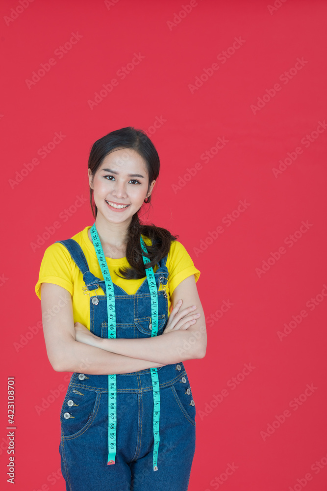 Female fashion designer standing with arm crossed.. Female fashion designer standing with arm crossed..