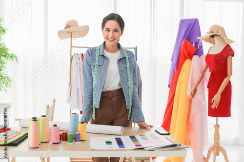 Female fashion designer standing smile..