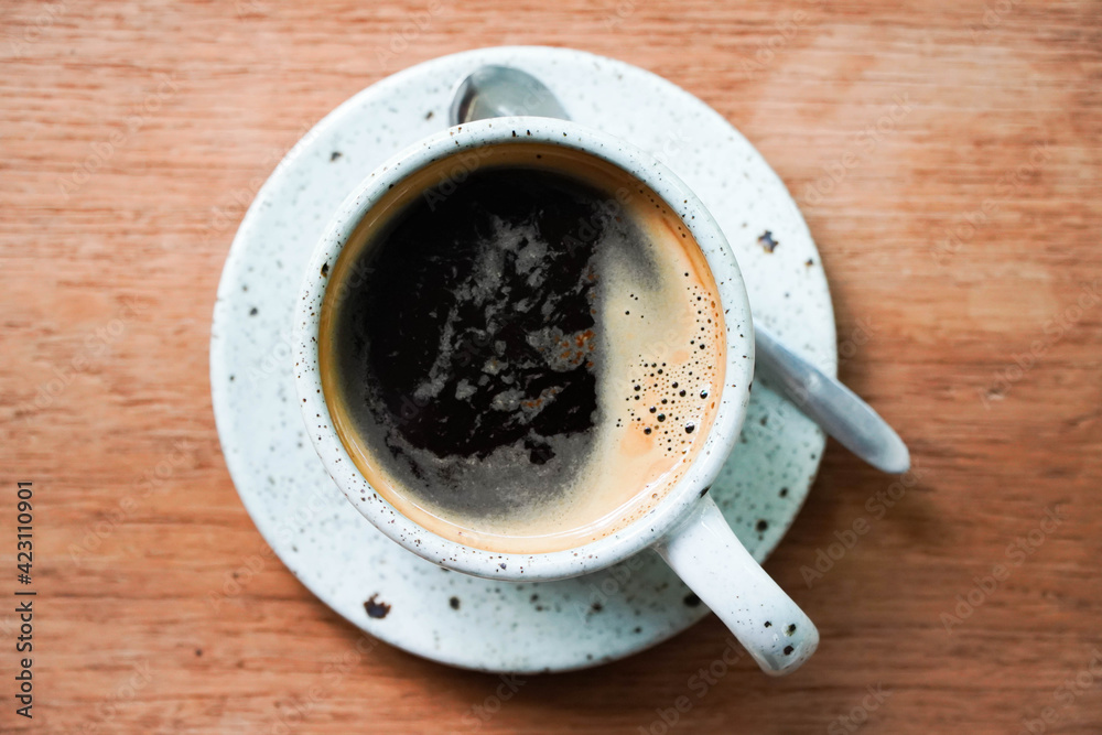 Top view of coffee cup on a wood background with copy space. hot coffee cup on a wooden table Top view of coffee cup on a wood background with copy space. hot coffee cup on a wooden table