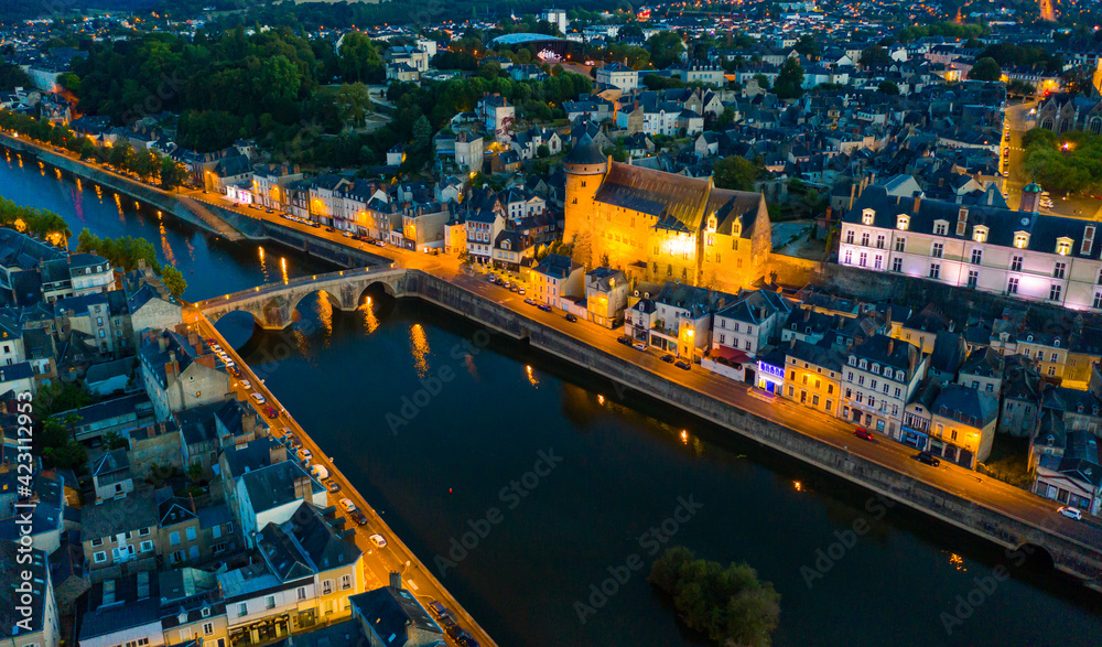 Evening aerial view of Laval with buildings, river Mayenne and old bridge, Mayenne department, north-western France