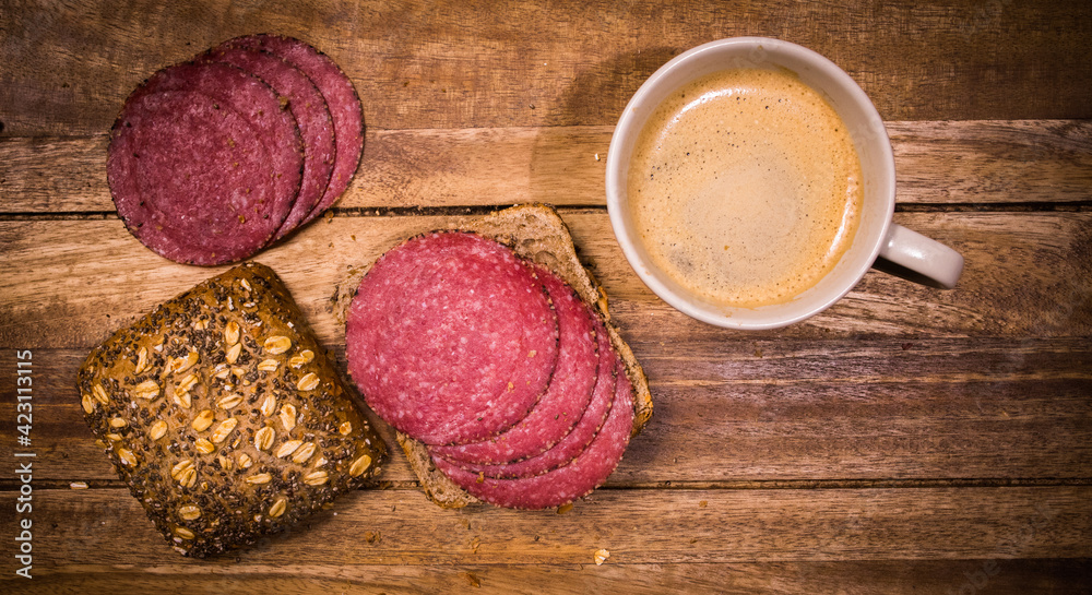 Breakfast table with rolls, coffee and sausage - top down view - food photography Breakfast table with rolls, coffee and sausage - top down view - food photography