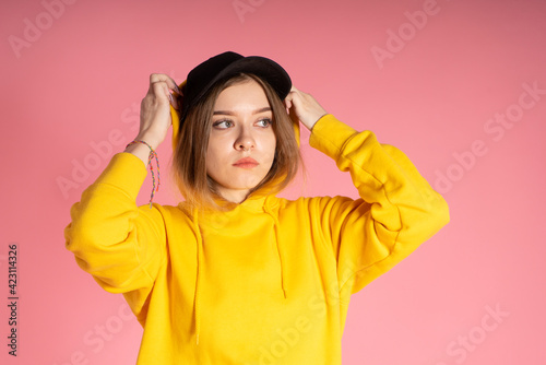 Sad woman puts on a hood