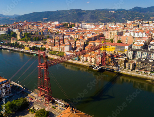 Aerial view of Vizcaya bridge over the river and cityscape at Portugalete, Spain