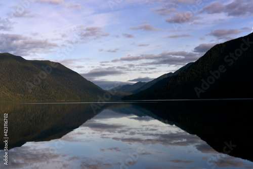 Mirror sky reflection and mountain  reflection on lake Crescent Olympic peninsula, Washington