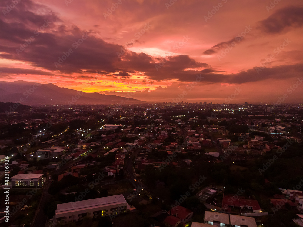 Beautiful aerial view of a pink and red sunset in the city of San Jose Costa Rica