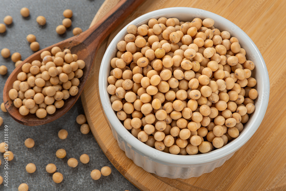 Bowl with soy beans. Detail of wooden spoon and bamboo support.