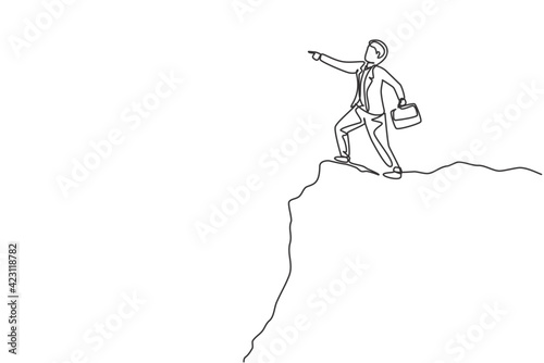 Single one line drawing young smart business man standing at cliff edge pointing finger to the sky. Business metaphor concept. Modern continuous line draw. Minimal design graphic vector illustration