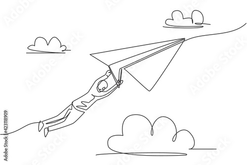 Continuous one line drawing young male worker hold and hang tight on flying paper airplane. Business challenge metaphor. Minimalist concept. Trendy single line draw design vector graphic illustration