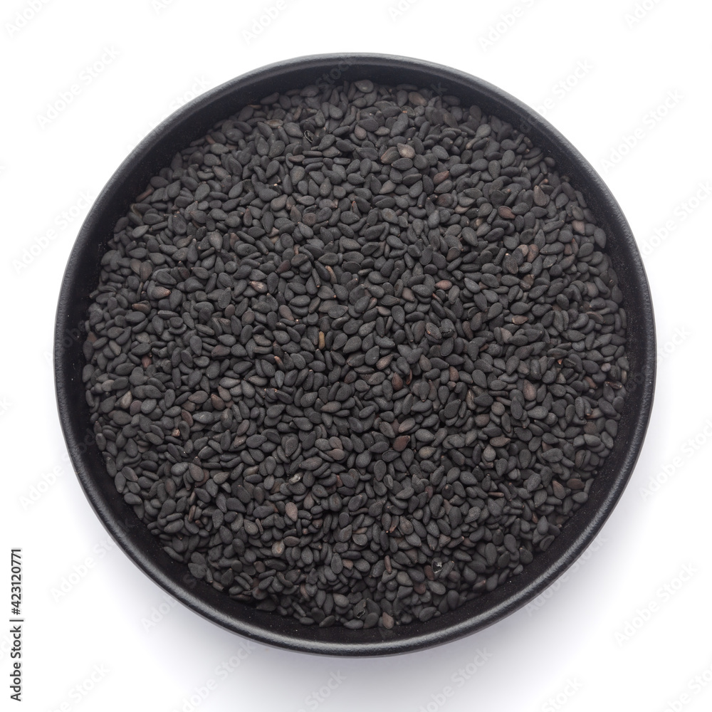 Macro Close up of Organic Black Sesame seeds(Sesamum indicum) or Black Til with shell inside a black ceramic bowl Macro Close up of Organic Black Sesame seeds(Sesamum indicum) or Black Til with shell inside a black ceramic bowl