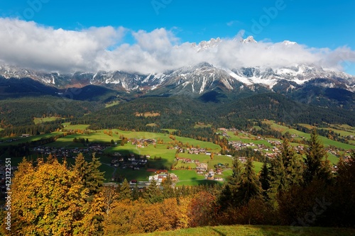 Fall scenery of Ellmau, a beautiful village in the grassy valley at the foothills of a majestic alpine mountain range ~ Magnificent autumn landscape of Wild Kaiser Mountains in Tirol, Austria, Europe