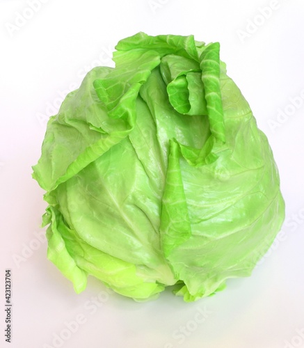 Foto Soft spring cabbage on white background.