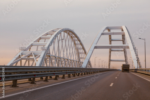 Fototapeta Naklejka Na Ścianę i Meble -  The bridge connecting Russia and the Crimean peninsula. Navigable arch of the Crimean bridge. Arch of the automobile and railway section of the Crimean.