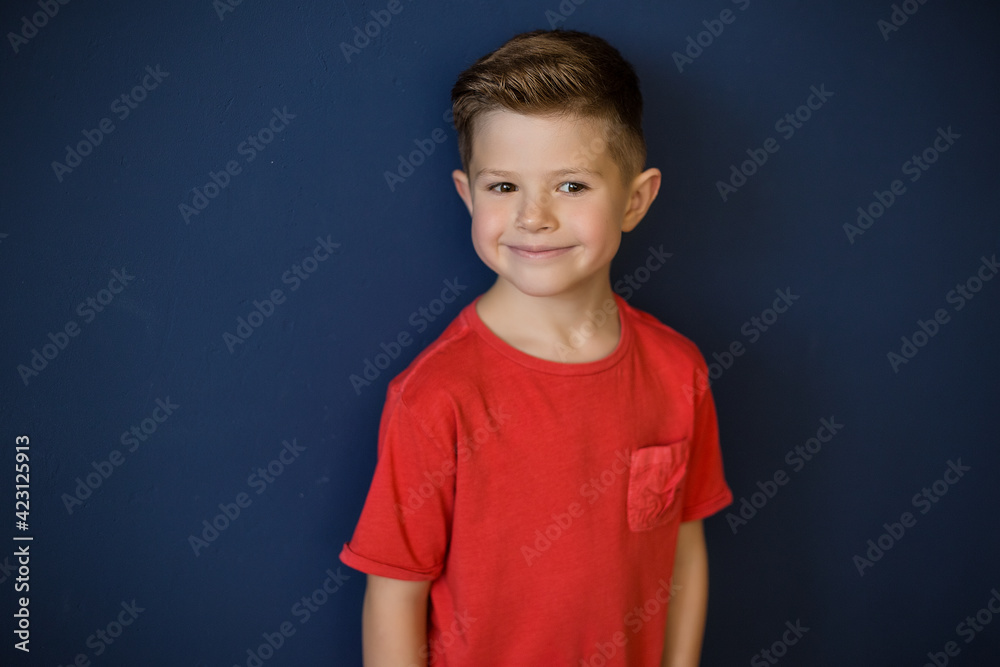 portrait of a boy in a red t-shirt portrait of a boy in a red t-shirt