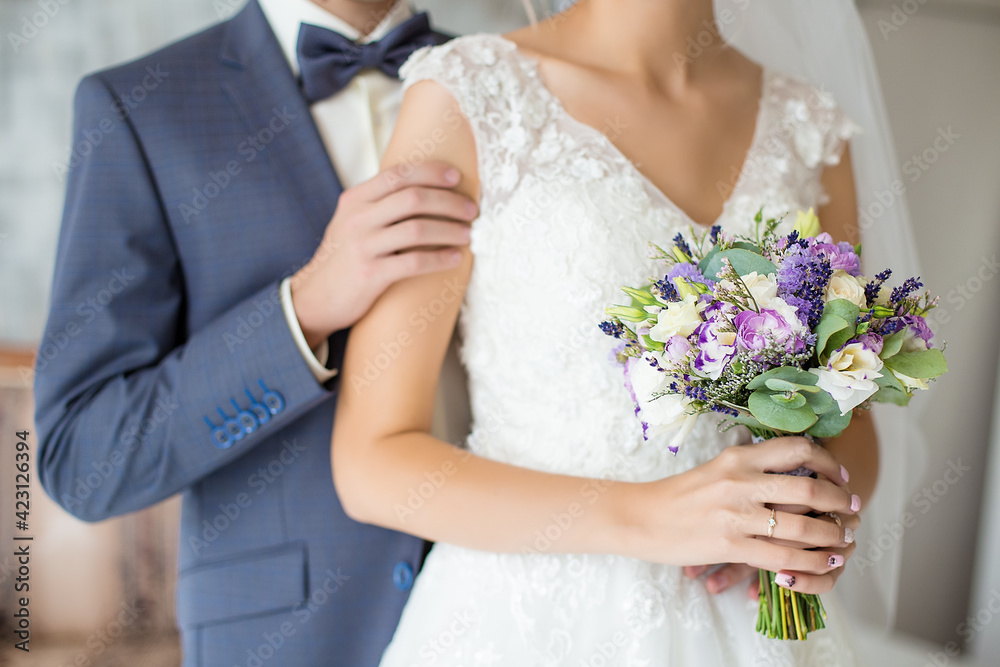wedding bouquet and newlyweds hands wedding bouquet and newlyweds hands